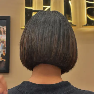 A back view of a sleek bob haircut, showing the clean lines and precision of the cut. This is a timeless style that is both chic and easy to maintain.