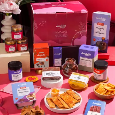 This is a full product lineup for a Valentine's Day snack box. I arranged all the items to look like an abundant, exciting gift, showcasing the entire collection in one comprehensive shot.