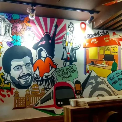 Our massive "History Wall" for Dosa Plaza in Koramangala. This side is all about Namma Bengaluru, featuring everything from Shankarnag and Yakshagana to RCB and the Namma Metro.