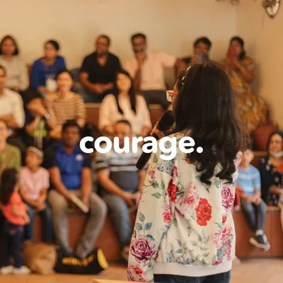 With courage, she takes the stage. Our public speaking showcases are a platform for students to share their voices with a supportive audience of family and friends.
