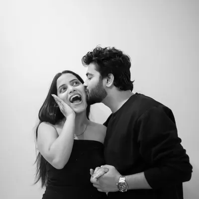 Pure, spontaneous joy. I prompted Omkar to give Riya a surprise kiss, and her reaction is priceless. Capturing these candid, happy moments in a simple black and white format makes the emotion even more powerful.