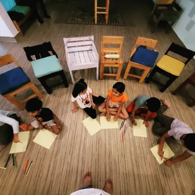 An overhead view of our little artists at work. After the story is over, we spread out on the floor for a fun, collaborative art session where everyone can draw what the story inspired in them.