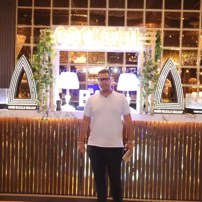 Here I am, Akhil Sabharwal, in front of one of our signature cocktail bar setups. I take personal pride in ensuring every event is a success, continuing a family legacy of exceptional catering.