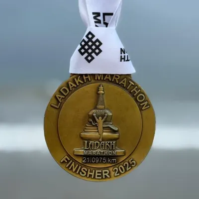 The coveted finisher medal from the Ladakh Half Marathon. Running at high altitude presents a unique challenge that our athletes train specifically for.