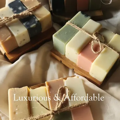My mini soap bundles are both luxurious and affordable. This image shows several bundles, each with an assortment of colorful mini soap bars resting on a wooden soap dish and tied with natural jute twine.