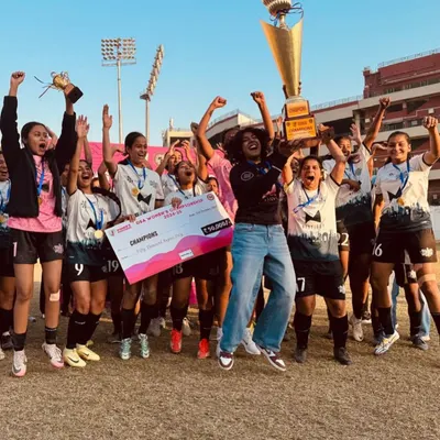 The moment of victory. Our Dream Team Women erupt in celebration after being crowned champions, lifting the trophy high. This is the result of relentless spirit and unwavering belief in each other.