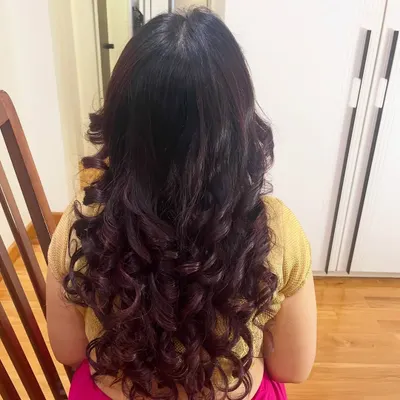 I love creating these voluminous, defined curls. This hairstyle was done on my client Anita's own hair, giving it body and movement.