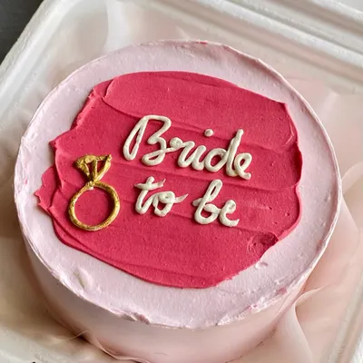 A "Bride to be" bento cake, perfect for a bridal shower or bachelorette party. These mini cakes are a great way to celebrate personal milestones in a sweet and intimate way.