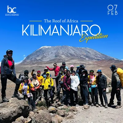 Our team posing for a group photo with the magnificent Mt. Kilimanjaro in the background. This is the start of an epic journey to the roof of Africa, one of the famed Seven Summits.
