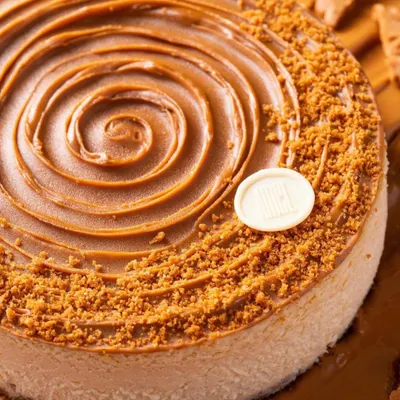 A close-up shot of a Biscoff cheesecake from House of Amel. We focused on the perfect swirl and crumbly texture to create a truly mouthwatering image.