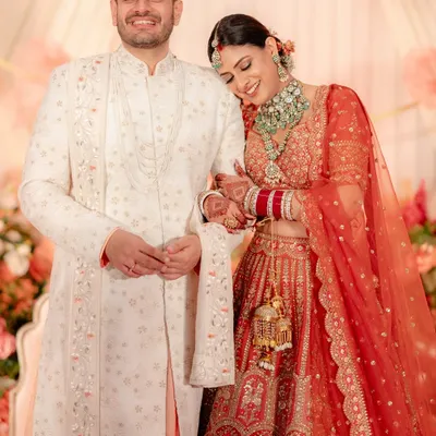 A beautiful portrait of the newlyweds, with the bride resting her head on the groom's shoulder, radiating contentment and love.