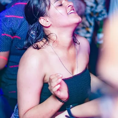 This is what it's all about. A partygoer completely lost in the music, feeling every beat. Capturing these moments of pure joy is the best part of my job.