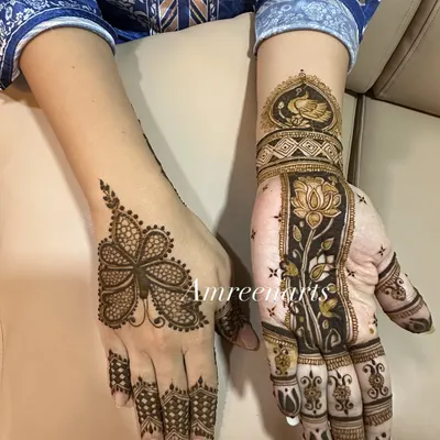 A beautiful example of two different styles for a festive occasion. One hand features a modern floral pattern, while the other has a more traditional design with a peacock and lotus.