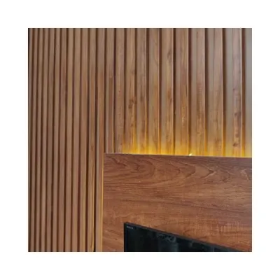 A detail of the fluted wood panelling used for the TV unit in the Makam Residence. This element adds texture and warmth, creating a feature that is both modern and timeless.