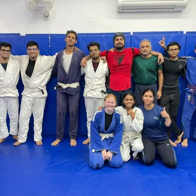 A fantastic group photo after a tough but rewarding training session. You can see a mix of gi and no-gi practitioners, all part of the same supportive martial arts family.
