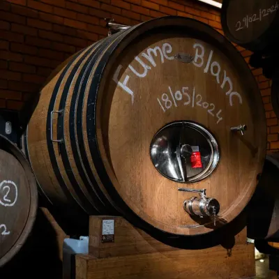 This is one of our rare Foudre barrels, where our La Réserve Fumé Blanc matures. Their large size allows the wine to refine its texture and gain depth without being overpowered by oak, preserving the crisp, expressive character of the Sauvignon Blanc.