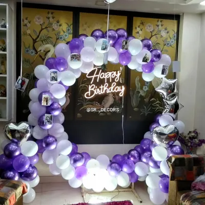 Here is a closer look at the personalized 18th birthday balloon ring. The combination of purple and white balloons, silver foil accents, and a central neon sign makes for a fantastic photo opportunity.