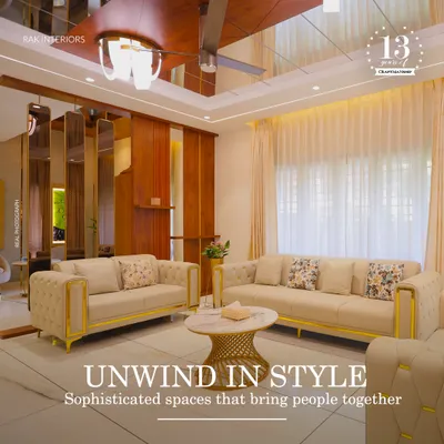 Unwind in style in this sophisticated living room. The design uses mirrors and reflective surfaces to create a sense of spaciousness, while the plush sofas with gold accents add a touch of glamour.