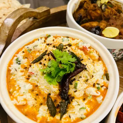 A comforting bowl of South Indian curd rice, tempered with spices and curry leaves. It's the perfect accompaniment to my spicy Prawn Ghee Roast or Chicken Chettinad.