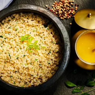 A bowl of simplicity, a spoonful of healing. This is our broken rice with a drizzle of golden ghee, a nourishing and easily digestible meal that comforts the gut and balances the doshas, forming a staple of our Ayurvedic diet.