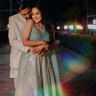 A romantic embrace during a night shoot. I used a prism to create the rainbow light flare, adding a touch of magic and dreaminess to this otherwise classic portrait.