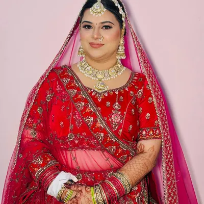 A radiant bride ready for her wedding ceremony. I created this classic look with soft-focus HD makeup, a traditional matha patti, and a nose ring to enhance her beautiful features.