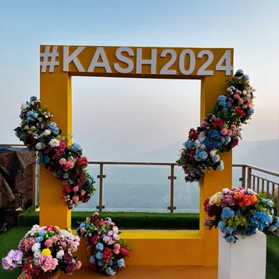 We create personalized, Instagram-worthy photo opportunities for you and your guests. This custom selfie booth, featuring the couple's wedding hashtag against a breathtaking mountain view, becomes a memorable focal point of the celebration.