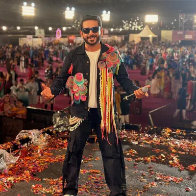 On stage at Rangraas Navratri, surrounded by confetti and a massive crowd. This is what a festival finale looks like, pure jalsa and celebration.