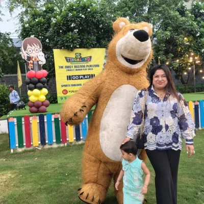 A magical moment with one of our cuddly mascots. We love creating special memories for both parents and children during their visit.