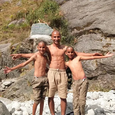 This photo with my two sons captures the spirit of our journey as a "NoBody" family. We let go of our identities to embrace the unknown, finding the essence of life through travel and connection. This was a time of deep spiritual growth and learning for all of us.
