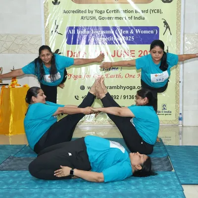 A stunning display of teamwork and artistry in a group yogasana formation at the All India Yogasana Competition. This pose, requiring immense trust and balance, showcases the high level of skill we nurture.