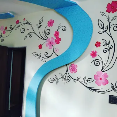 A beautiful floral vine mural painted along a curved ceiling arch. This type of decorative wall art adds a soft, organic touch to home interiors.