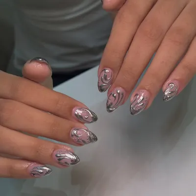 A closer look at the liquid metal effect of this chrome nail art. I carefully hand-paint the swirls over a sheer nude base to create depth and a floating effect.