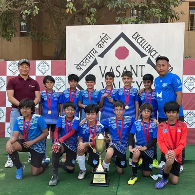 Success in school sports. Our head coach Thotthan Mung with his victorious team from The Shiv Nadar Schools, showcasing the results of our management program.