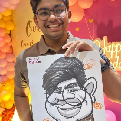 A guest at Ovee's first birthday party, set against a beautiful balloon backdrop. My caricatures add a personal touch to any party's decor and theme.