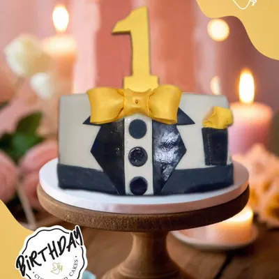 A dapper little cake for a dapper little boy. This tuxedo-themed cake is a stylish and cute way to celebrate a first birthday.