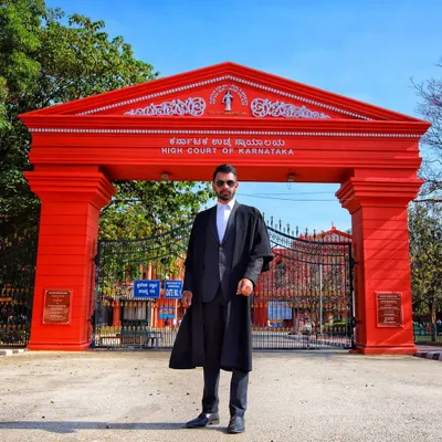 Dressed in my advocate's robes outside the High Court of Karnataka. This is where I handle a significant portion of my cases, from criminal defense appeals to complex family law disputes.