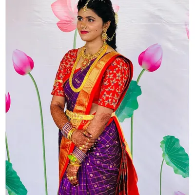 My beautiful client Dixita, ready for her pellikuthuru function. For this Telugu pre-wedding ceremony, we chose a classic look with a bold red lip and defined eyes to complement her vibrant purple and red silk saree.