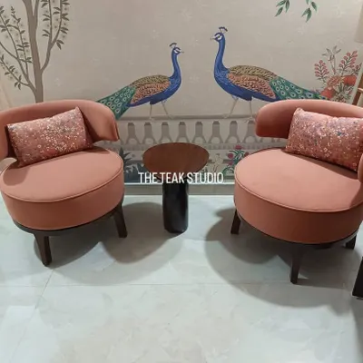 We love how these custom-made accent chairs in a dusty rose fabric turned out. Paired with sequined cushions and set against a beautiful peacock mural, they create a charming and elegant seating nook.