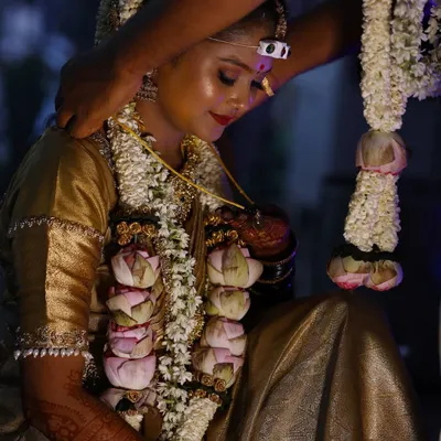 A quiet, emotional moment during the wedding ceremony. My long lasting, water resistant makeup ensures the bride looks flawless even through happy tears and hours of rituals.