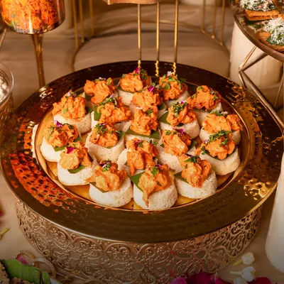 A modern Indian classic, reimagined. These Chicken Tikka Open Sliders are served on soft, fluffy bread, offering a familiar yet elevated bite that's always a crowd-pleaser at parties.