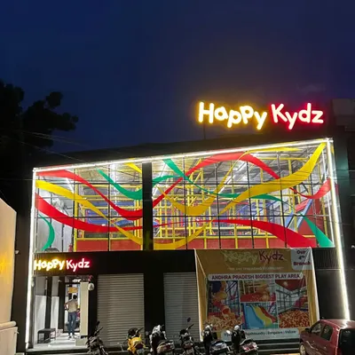 The vibrant exterior of our Vijayawada branch at night. Our colorful and inviting entrance welcomes families for an evening of fun.