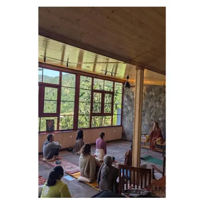 The completed meditation space in use, fulfilling its purpose as a center for stillness and reflection. The design, with its natural light and views, creates a tranquil atmosphere for guests.