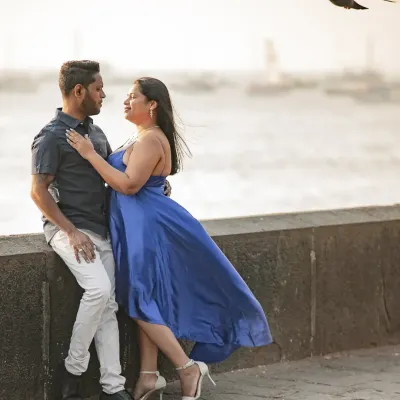 A perfect moment from a pre-wedding shoot at a Mumbai sea face, with a bird flying past at just the right time. I love how the wind catches her dress, adding a dynamic feel to this romantic couple portrait.