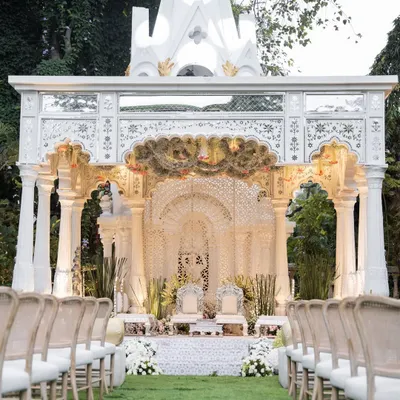 A view down the aisle towards the breathtaking mandap I designed for the Birla wedding. The structure was inspired by classic Indian architecture, creating a regal and timeless setting for the ceremony.