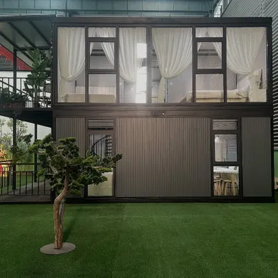 This two-story container home is a perfect example of stylish, sustainable living. The design features large glass windows for natural light and a second-floor balcony, all built within a strong steel frame.