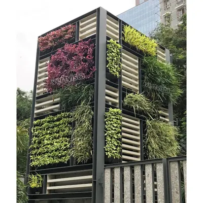 For spaces where a traditional wall isn't an option, we design freestanding vertical garden structures. This installation acts as an architectural feature, using different plant varieties in a block pattern to create a living, breathing sculpture.