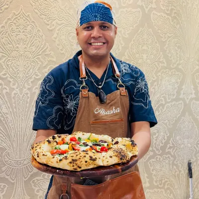 Here I am, ready to serve at a private catering event. I bring everything needed to make fresh, contemporary Neapolitan pizzas for you and your guests.