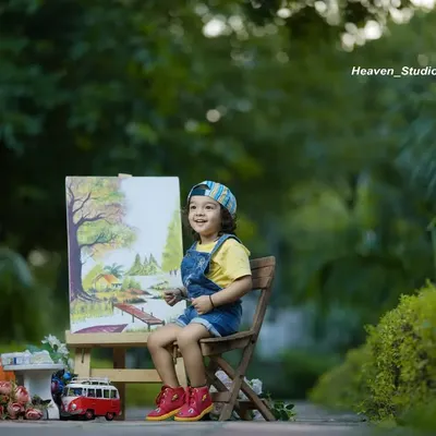 Dream big, little star. This outdoor 'Little Artist' setup, complete with an easel and paints, is a creative way to capture your child's imagination.