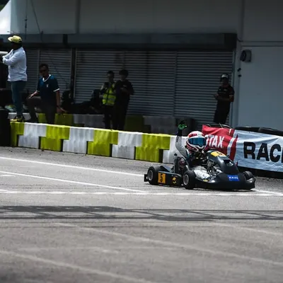Our driver crosses the finish line at the RMC Asia Trophy at Sepang, representing India on the international stage.